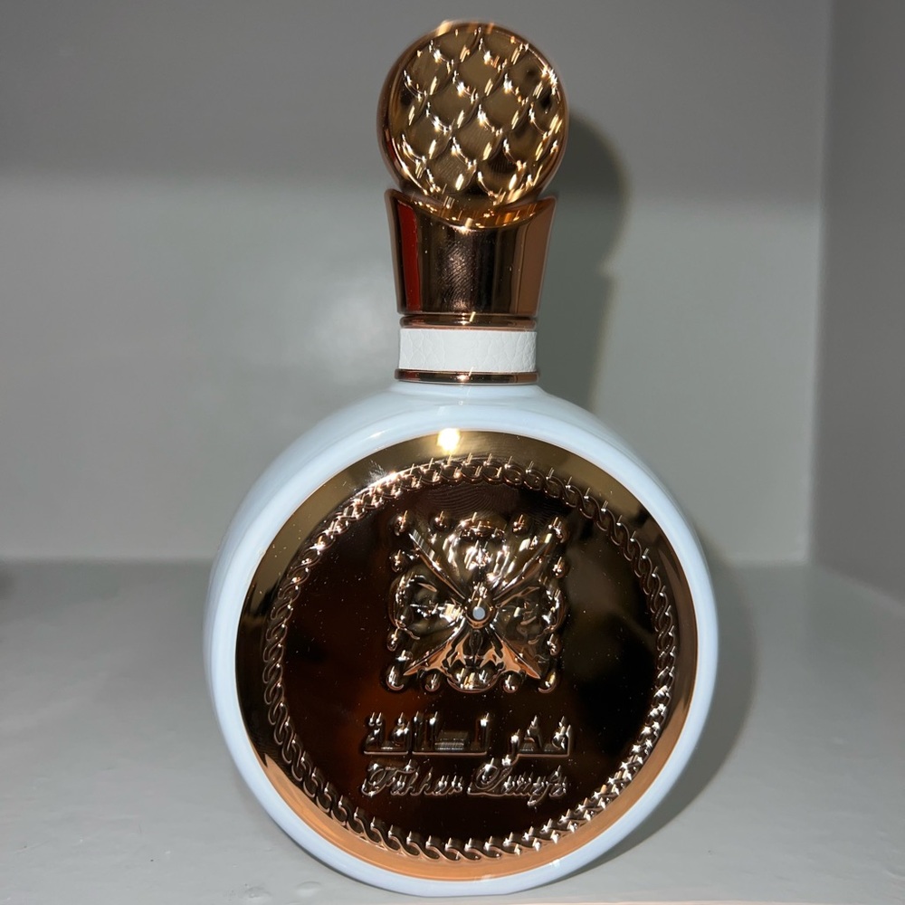 Elegant White and Gold Perfume Bottle